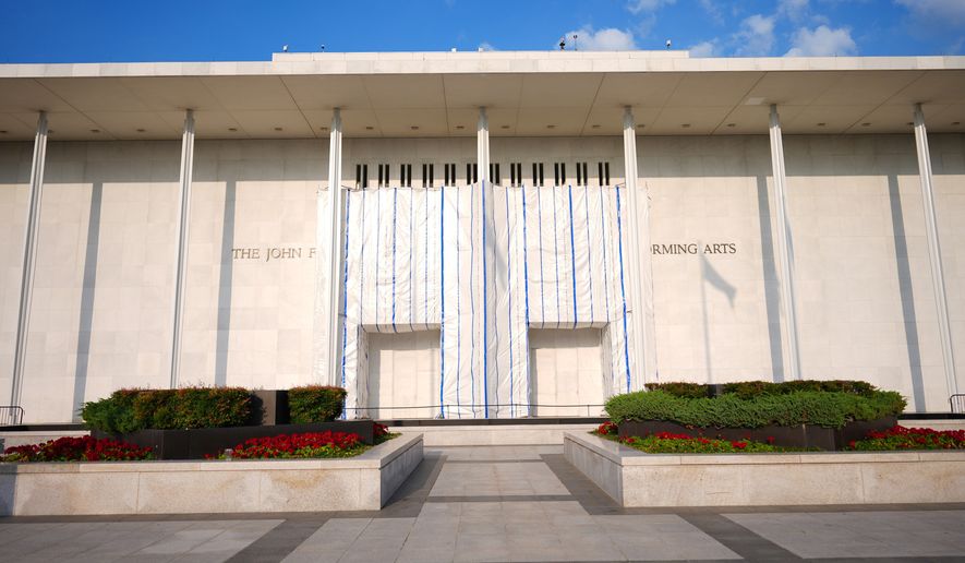 A tarp covers a portions of the signage at the John F. Kennedy Center for the Performing Arts, Thursday, Sept. 17, 2026 in Washington. (AP Photo/Pablo Martinez Monsivais)