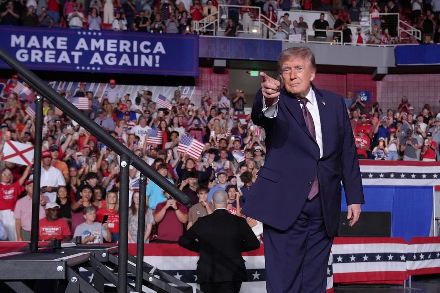 President Donald Trump gestures at a campaign rally at The Mitchell Center in Mobile, Ala., Friday, Oct. 2, 2026. (AP Photo/Jacquelyn Martin)