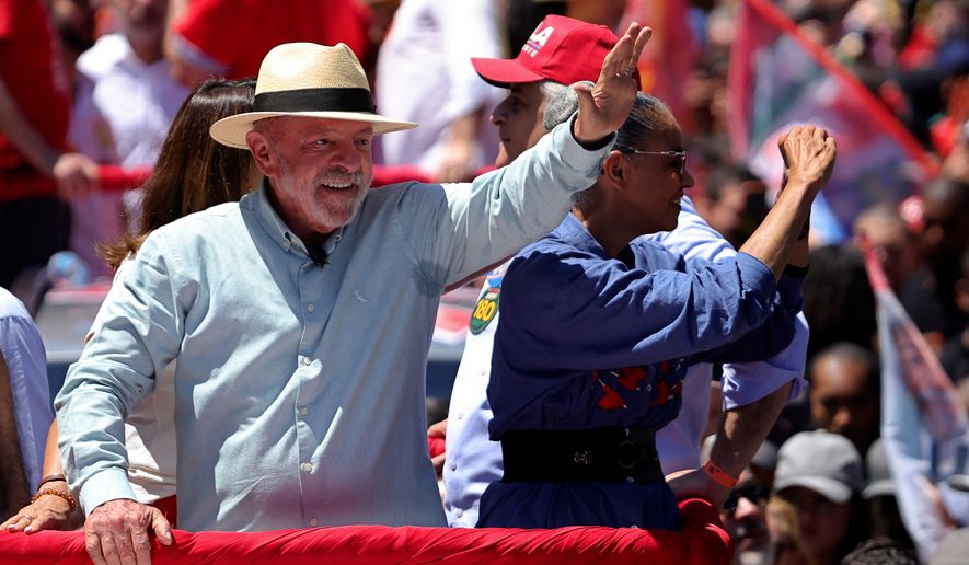 Brazilian President Luiz Inacio Lula da Silva, who is running for reelection, waves to supporters during a campaign rally in Sao Paulo, Brazil, Saturday, Sept. 26, 2026. (AP Photo/Allison Sales)