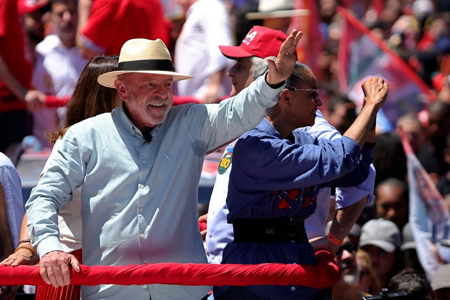 Brazilian President Luiz Inacio Lula da Silva, who is running for reelection, waves to supporters during a campaign rally in Sao Paulo, Brazil, Saturday, Sept. 26, 2026. (AP Photo/Allison Sales)