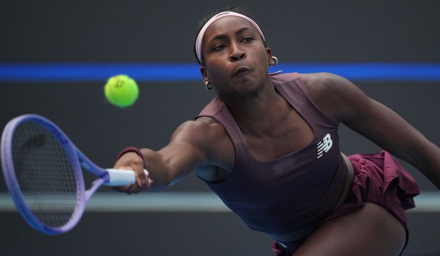 Coco Gauff, of the United States, returns a ball to Camila Osorio, of Colombia, during the second round of the women's singles match at the China Open tennis tournament in Beijing, Saturday, Oct. 3, 2026. (AP Photo/Achmad Ibrahim)