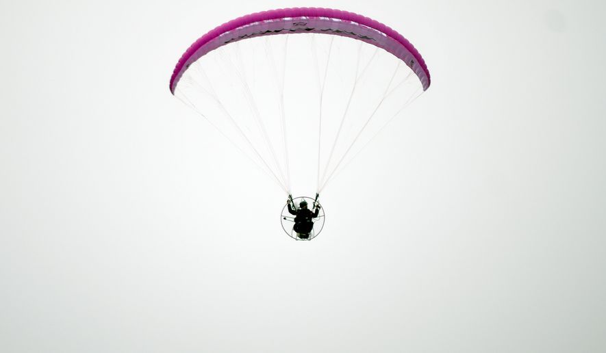 Jake Hutzler flies his paramotor near his home in Pueblo, Colo., on Friday, Oct. 2, 2026. (AP Photo/Thomas Peipert)