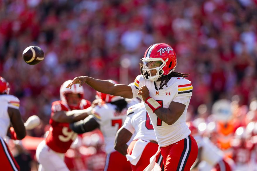 Maryland quarterback Malik Washington passes the ball against Nebraska during the first half of an NCAA college football game Saturday, Oct. 3, 2026, in Lincoln, Neb. (AP Photo/Rebecca S. Gratz)