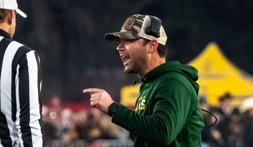 Colorado State interim head coach Tyson Summers speaks to the officials during an NCAA college football game against Wyoming on Saturday, Oct. 25, 2025, in Laramie, Wyo. (Milo Gladstein /The Wyoming Tribune Eagle via AP)/The Wyoming Tribune Eagle via AP, File)