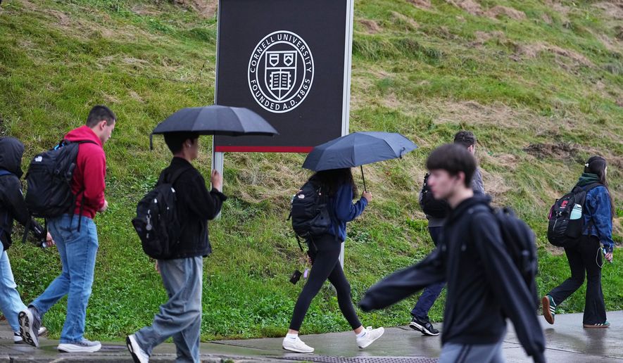 Students walk across the campus of Cornell University in Ithaca, N.Y., Thursday, Oct. 1, 2026. (AP Photo/Matt Rourke)