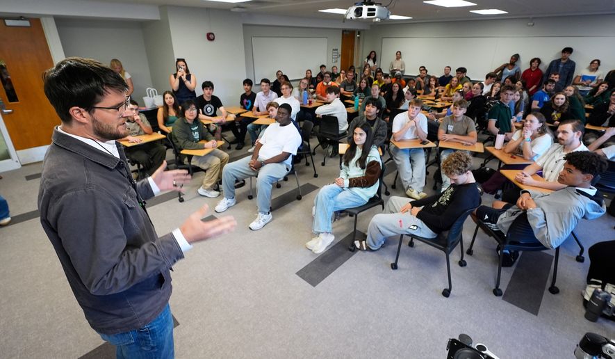 William Lawrence, Democratic candidate for U.S. House of Representatives in Michigan's 7th District speaks on the campus of Michigan State University during a campaign event Tuesday, Sept. 15, 2026, in East Lansing, Mich. (AP Photo/Paul Sancya)