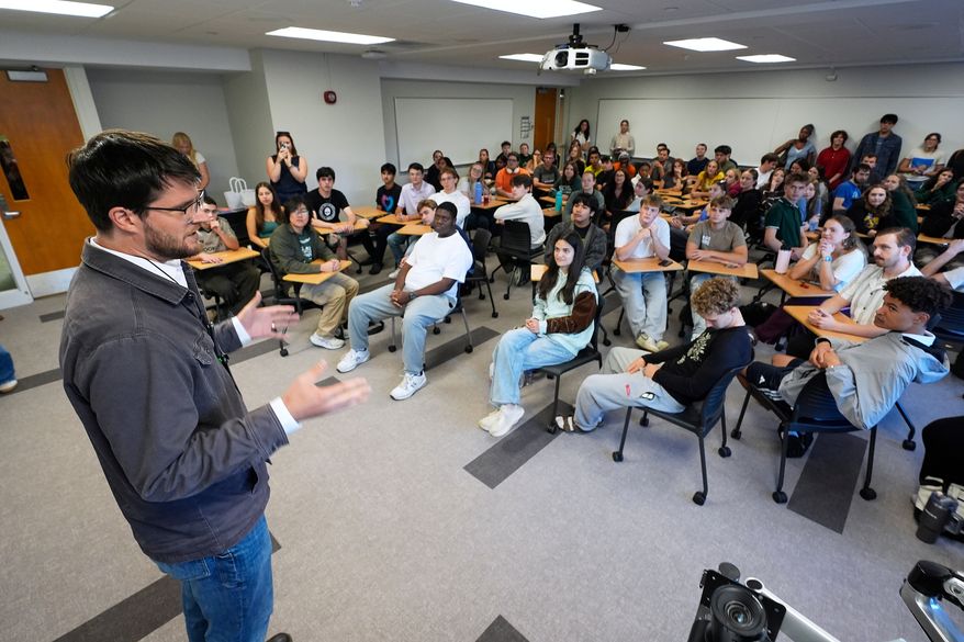 William Lawrence, Democratic candidate for U.S. House of Representatives in Michigan's 7th District speaks on the campus of Michigan State University during a campaign event Tuesday, Sept. 15, 2026, in East Lansing, Mich. (AP Photo/Paul Sancya)