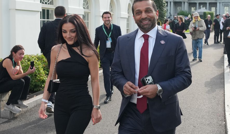 FBI director Kash Patel, right, and Alexis Wilkins arrive at the White House ahead of the UFC Freedom 250 on the South Lawn, June 14, 2026, in Washington. (AP Photo/Alex Brandon, File)