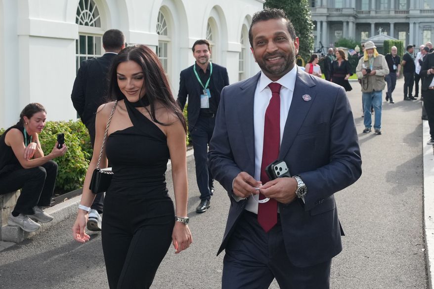 FBI director Kash Patel, right, and Alexis Wilkins arrive at the White House ahead of the UFC Freedom 250 on the South Lawn, June 14, 2026, in Washington. (AP Photo/Alex Brandon, File)