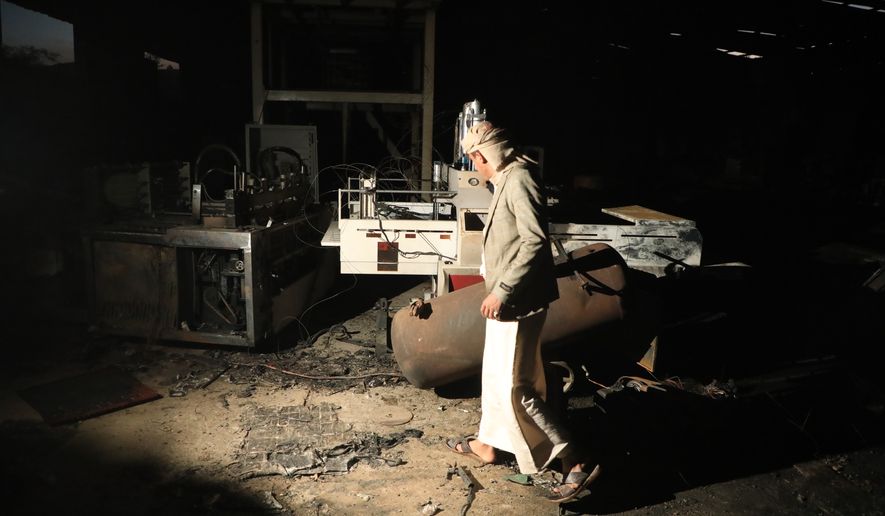 A man walks inside a damaged sponge factory in Sanaa, Yemen, Sunday, Oct. 4, 2026. (AP Photo/Osamah Abdulrahman)