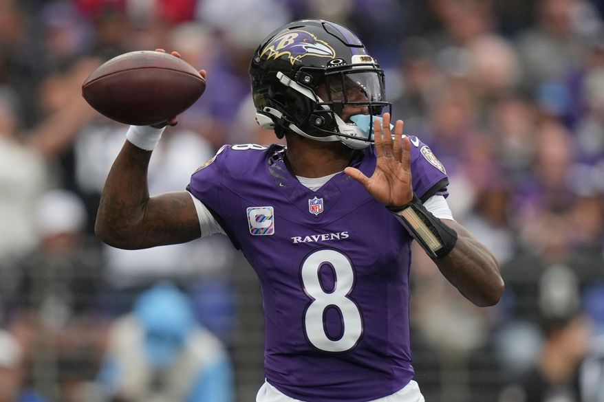 Baltimore Ravens quarterback Lamar Jackson (8) looks to throw a pass during the first half of an NFL football game in Baltimore, Sunday, Oct. 4, 2026. (AP Photo/Stephanie Scarbrough)