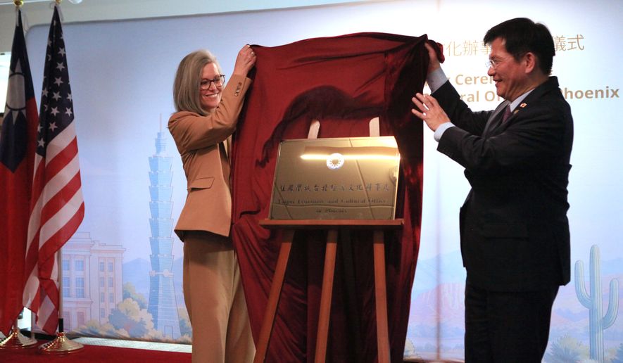 Arizona Gov. Katie Hobbs, left, and Taiwan's Foreign Minister Lin Chia-Lung unveil the plaque at the opening of the Taipei Economic and Cultural Office in Phoenix on Monday, Oct. 5, 2026. (AP Photo/Wufei Yu)