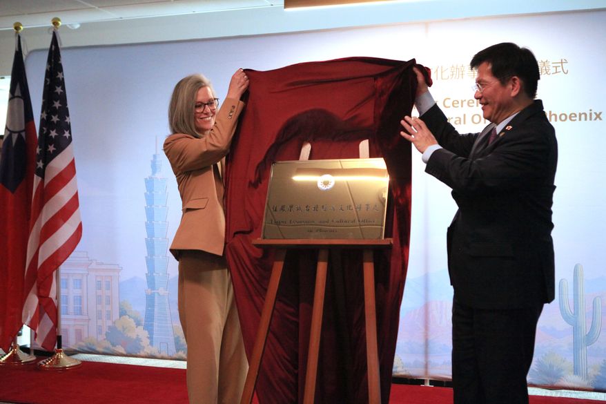 Arizona Gov. Katie Hobbs, left, and Taiwan's Foreign Minister Lin Chia-Lung unveil the plaque at the opening of the Taipei Economic and Cultural Office in Phoenix on Monday, Oct. 5, 2026. (AP Photo/Wufei Yu)