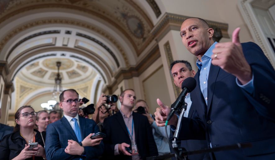 House Minority Leader Hakeem Jeffries, D-N.Y., the top Democrat in the Republican-majority House, is joined by Rep. Pete Aguilar, D-Calif., chair of the House Democratic Caucus, as they criticize President Donald Trump and his policies while talking to reporters about the approaching midterm election, at the Capitol in Washington, Thursday, Sept. 17, 2026. (AP Photo/J. Scott Applewhite)