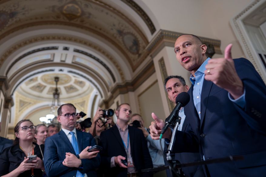 House Minority Leader Hakeem Jeffries, D-N.Y., the top Democrat in the Republican-majority House, is joined by Rep. Pete Aguilar, D-Calif., chair of the House Democratic Caucus, as they criticize President Donald Trump and his policies while talking to reporters about the approaching midterm election, at the Capitol in Washington, Thursday, Sept. 17, 2026. (AP Photo/J. Scott Applewhite)
