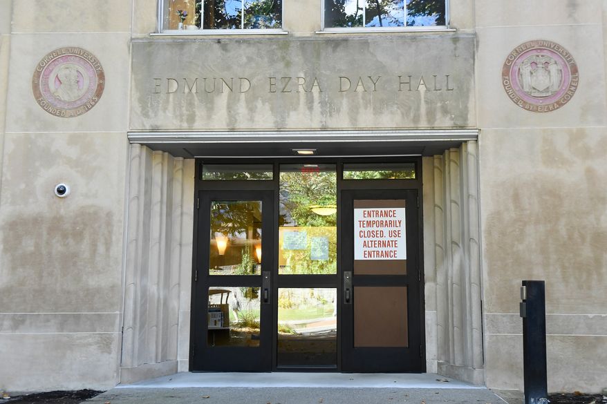 A sign is displayed on a door at Day Hall after damage and graffiti overnight was cleaned up at Cornell University, Monday, Oct. 5, 2026, in Ithaca, N.Y. (AP Photo/Adrian Kraus)