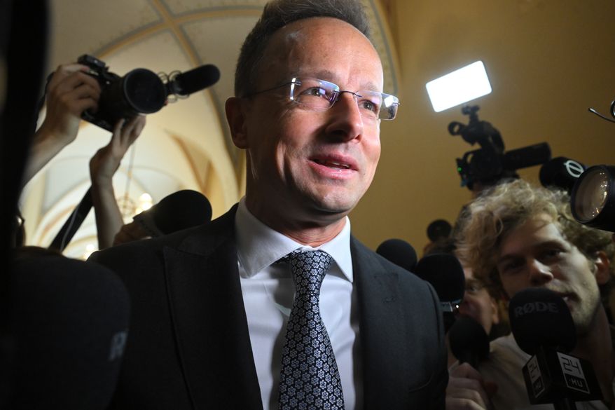 Former Hungarian Minister of Foreign Affairs and Trade Peter Szijjarto talks to the press as he arrives for a closed-door hearing by the National Security Committee of the National Assembly in the parliament building in Budapest, Hungary, Monday, Oct. 5, 2026. (Noemi Bruzak/MTI via AP)