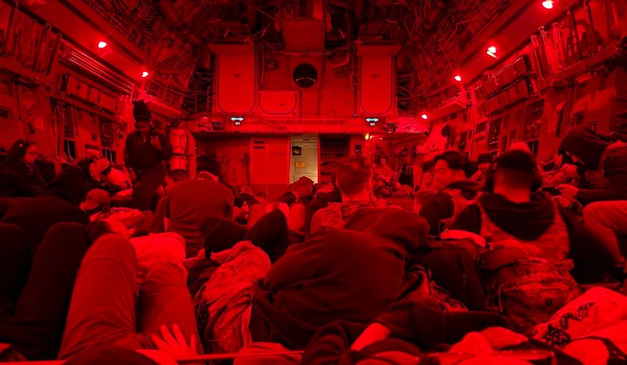 In this photo obtained by The Associated Press, U.S. soldiers, including those injured after an Iranian drone strike on Port Shuaiba, sit inside a military transport plane as they are evacuated from Kuwait, March 10, 2026. (AP Photo)