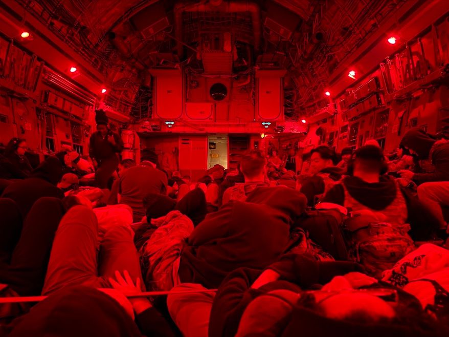In this photo obtained by The Associated Press, U.S. soldiers, including those injured after an Iranian drone strike on Port Shuaiba, sit inside a military transport plane as they are evacuated from Kuwait, March 10, 2026. (AP Photo)