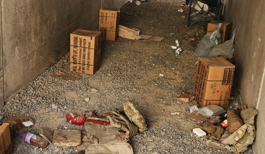 In this photo obtained by The Associated Press, discarded military gear and a bloody bandage are seen inside a bunker at Port Shuaiba in Kuwait on March 1, 2026, after an Iranian drone strike killed multiple U.S. soldiers and injured dozens more. (AP Photo)