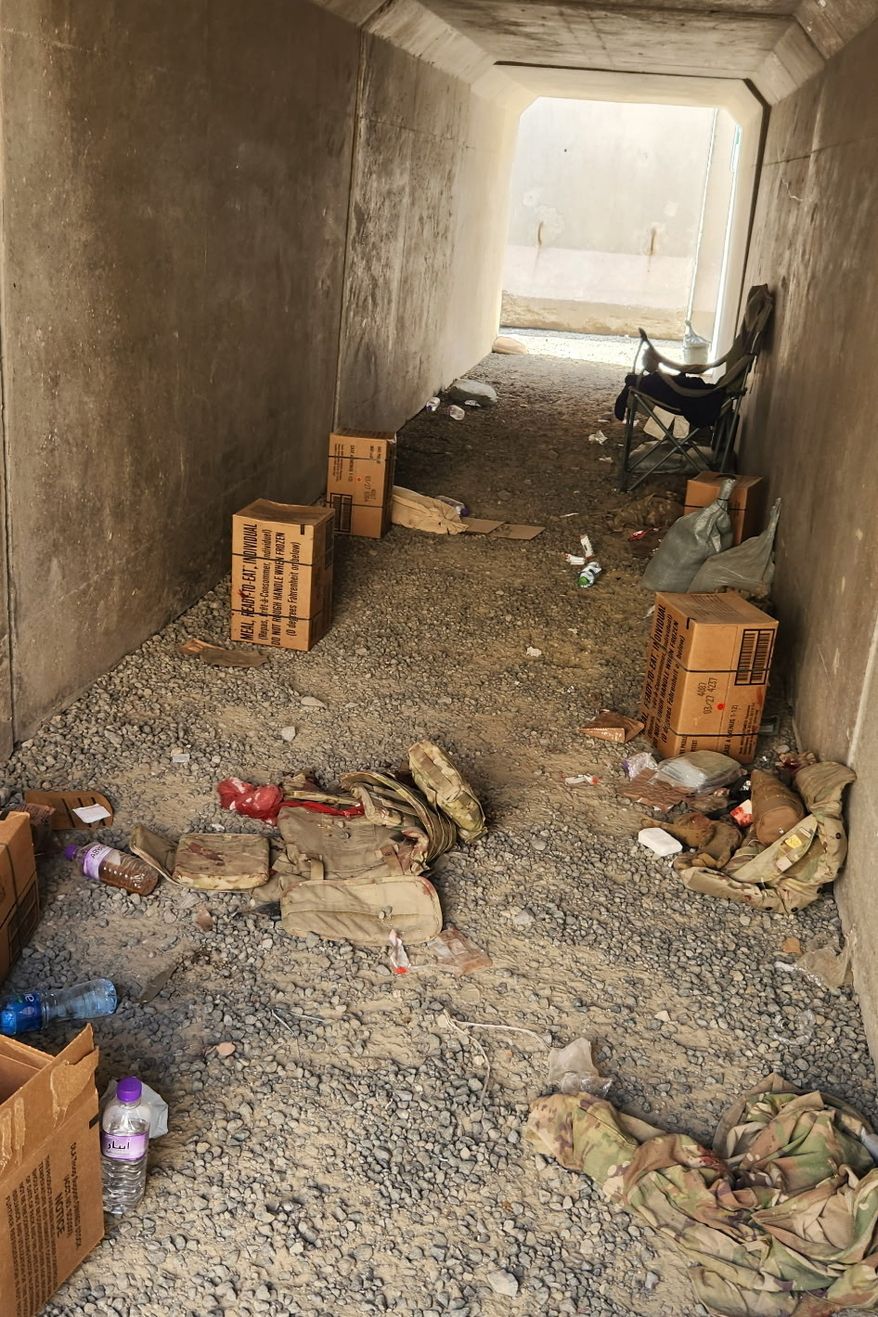 In this photo obtained by The Associated Press, discarded military gear and a bloody bandage are seen inside a bunker at Port Shuaiba in Kuwait on March 1, 2026, after an Iranian drone strike killed multiple U.S. soldiers and injured dozens more. (AP Photo)