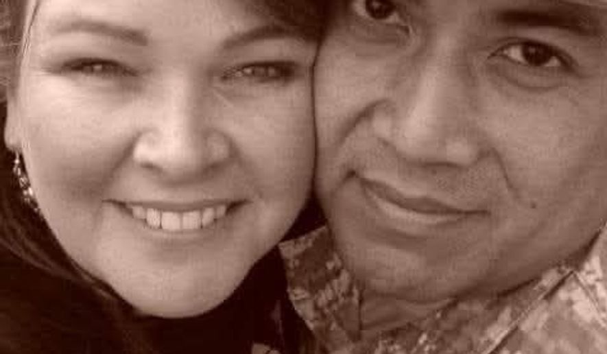 This undated image provided by Tina Marzan shows her, left, posing for a selfie with her husband Chief Warrant Officer 3 Robert Marzan, who was killed in an Iranian drone strike on a U.S. military site at Port Shuaiba in Kuwait on March 1, 2026. (Tina Marzan via AP)