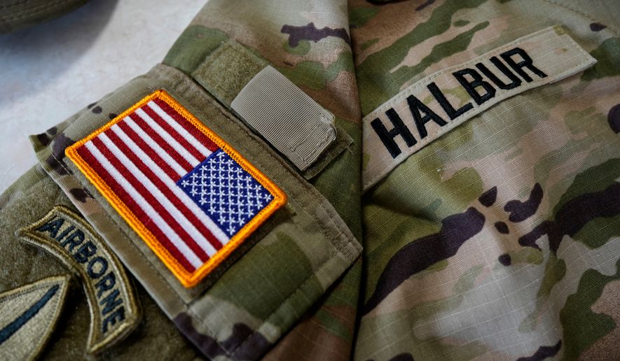 Lt. Col. Tim Halbur's uniform is seen in his home, Thursday, Sept. 24, 2026, in Ankeny, Iowa, after Halbur was injured in an Iranian drone strike at Port Shuaiba in Kuwait. (AP Photo/Charlie Neibergall)