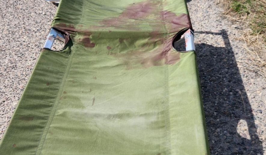 In this photo obtained by The Associated Press, blood stains a stretcher at Port Shuaiba in Kuwait on March 1, 2026, after an Iranian drone strike killed multiple U.S. soldiers and injured dozens more. (AP Photo)