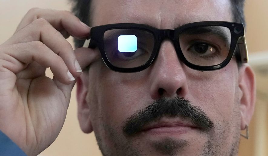 Michael Mcloughlin, of El Confidencial, gets a demonstration of Gemini on Android XR glasses at a Google I/O event in Mountain View, Calif., Tuesday, May 20, 2025. (AP Photo/Jeff Chiu, File)