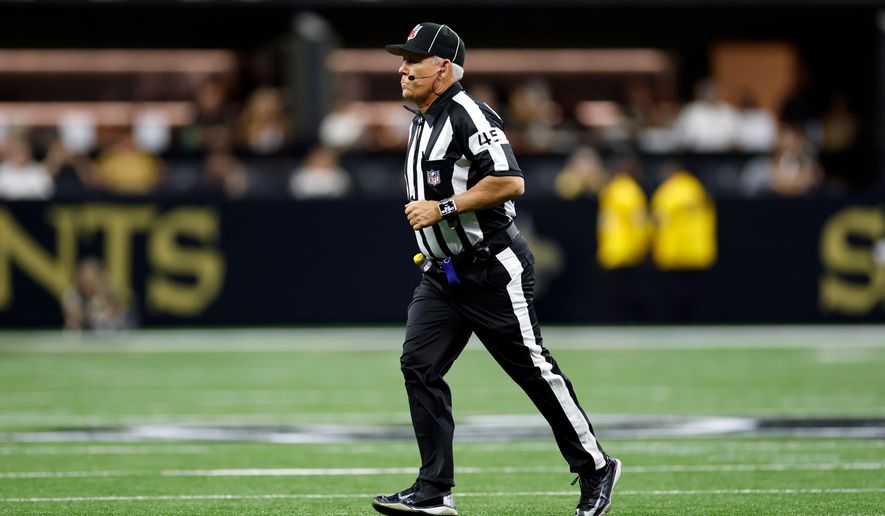 Line judge Jeff Seeman (45) works during an NFL preseason football game between the New Orleans Saints and the Jacksonville Jaguars in New Orleans, Aug. 15, 2026. (AP Photo/Tyler Kaufman, File)