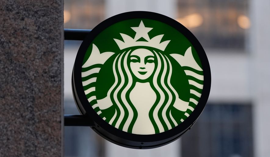 The Starbucks logo is displayed on a coffee shop, Nov. 24, 2025, in Boston. (AP Photo/Charles Krupa, File)