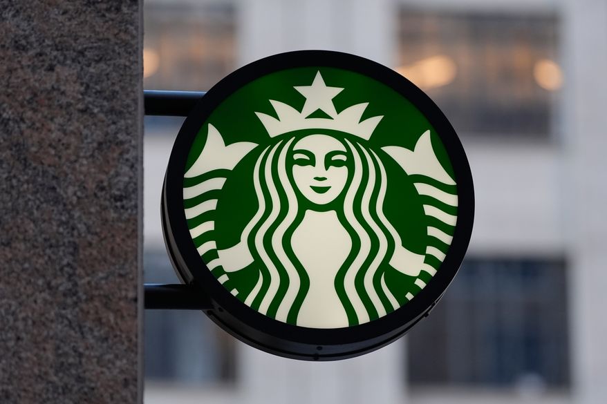 The Starbucks logo is displayed on a coffee shop, Nov. 24, 2025, in Boston. (AP Photo/Charles Krupa, File)