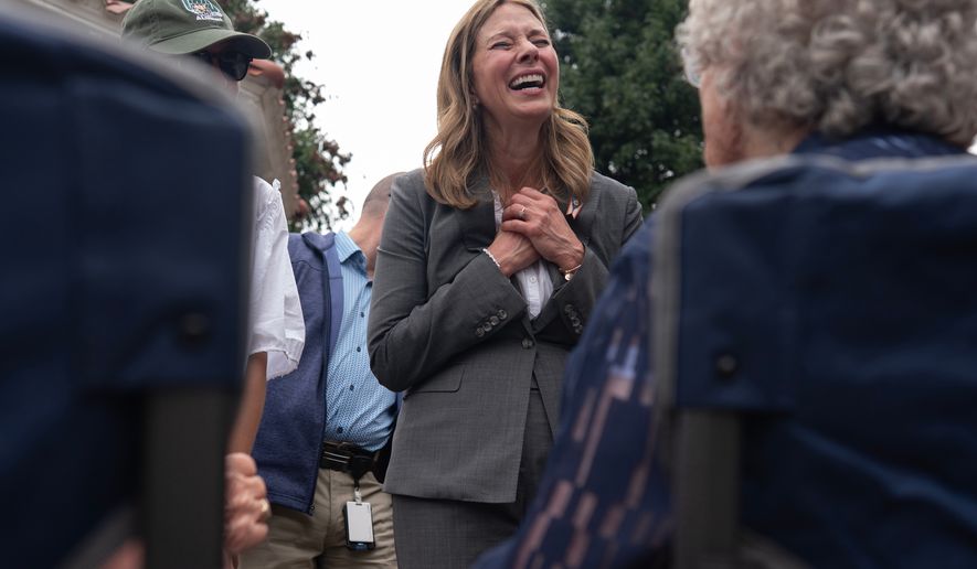 Democratic gubernatorial candidate Dr. Amy Acton visits with supporters during a campaign event along the Ohio River, in Marietta, Ohio, Thursday, Sept. 17, 2026. (AP Photo/Carolyn Kaster)
