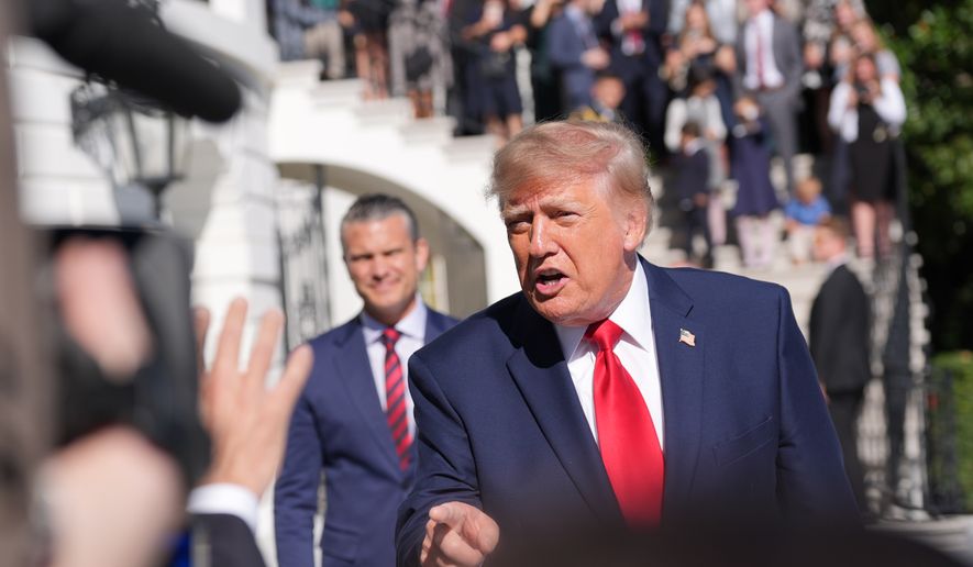 President Donald Trump speaks with reporters before departing on Marine One from the South Lawn of the White House, Tuesday, Oct. 6, 2026, in Washington, as Defense Secretary Pete Hegseth and Gold Star families watch. (AP Photo/Alex Brandon)