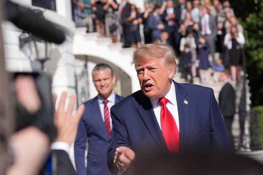 President Donald Trump speaks with reporters before departing on Marine One from the South Lawn of the White House, Tuesday, Oct. 6, 2026, in Washington, as Defense Secretary Pete Hegseth and Gold Star families watch. (AP Photo/Alex Brandon)
