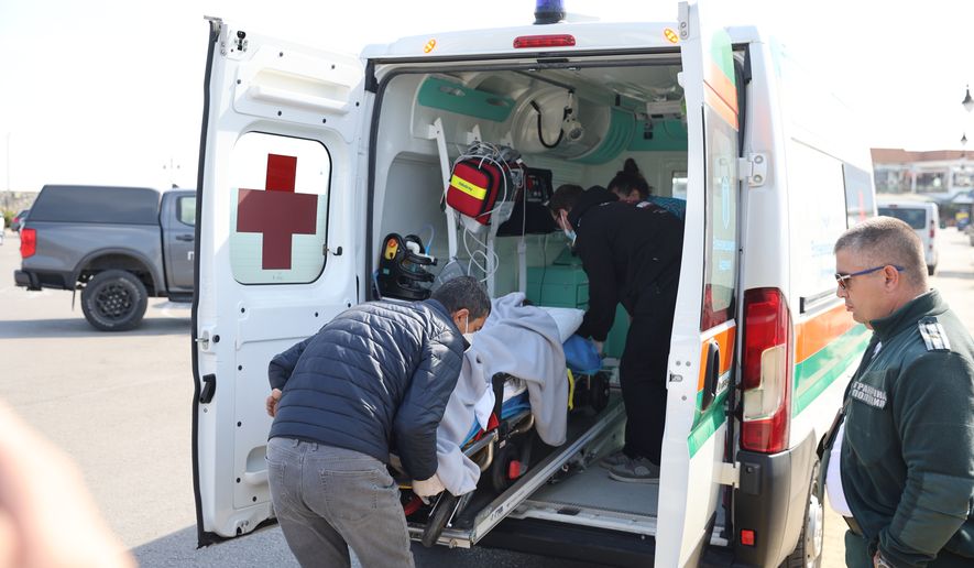 Bulgarian authorities take an injured crew member to a hospital after two commercial vessels were attacked in the NATO member's Black Sea economic zone on Tuesday, Oct. 6, 2026, Varna, in what was the first such attack on shipping in the area. (Bulgarian News Agency via AP)