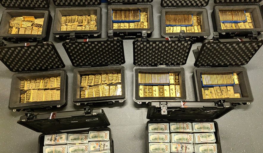 This image provided by U.S. Department of Justice, and contained in a court filing, shows gold bars and cash that was seized from a David J. Rush's home, during a search on May 19, 2026, in Ashburn, Va. (AP Photo/Justice Department via AP)