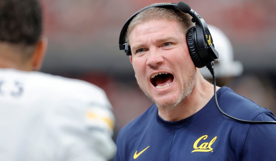 California head coach Tosh Lupoi gives instructions to a player during the second half of an NCAA college football game against UNLV, Saturday, Oct. 3, 2026, in Las Vegas. (Steve Marcus/Las Vegas Sun via AP)