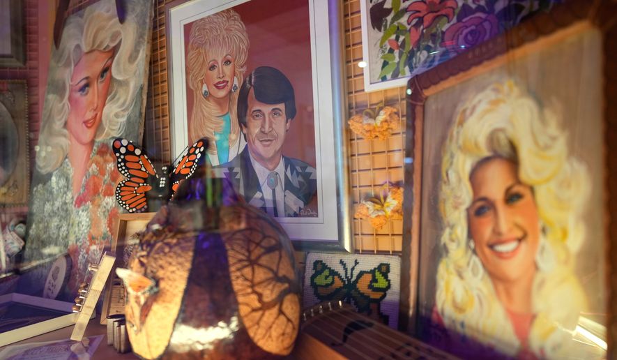 Portraits of Dolly Parton are seen at the Dolly's Life of Many Colors Museum, Tuesday, Oct. 6, 2026, in Nashville, Tenn. (AP Photo/George Walker IV)