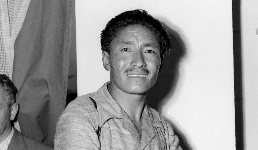 Sherpa Tenzing Norgay appears at Ciampino Airport in Rome, Italy during a stopover on July 2, 1953. (AP Photo/James Pringle, File)
