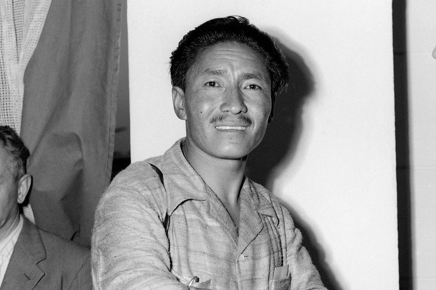 Sherpa Tenzing Norgay appears at Ciampino Airport in Rome, Italy during a stopover on July 2, 1953. (AP Photo/James Pringle, File)