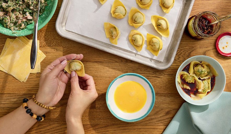 This image released by S&S/Element shows a recipe for Popo's wontons from the cookbook, “Have You Eaten Yet?,” by Ming-Na Wen. (Jennifer Chong/S&S/Element via AP)
