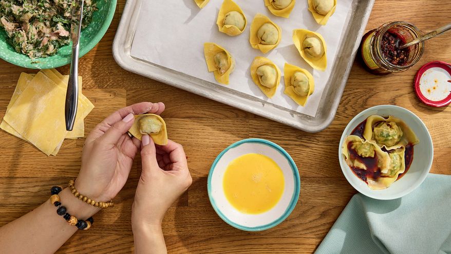 This image released by S&S/Element shows a recipe for Popo's wontons from the cookbook, “Have You Eaten Yet?,” by Ming-Na Wen. (Jennifer Chong/S&S/Element via AP)