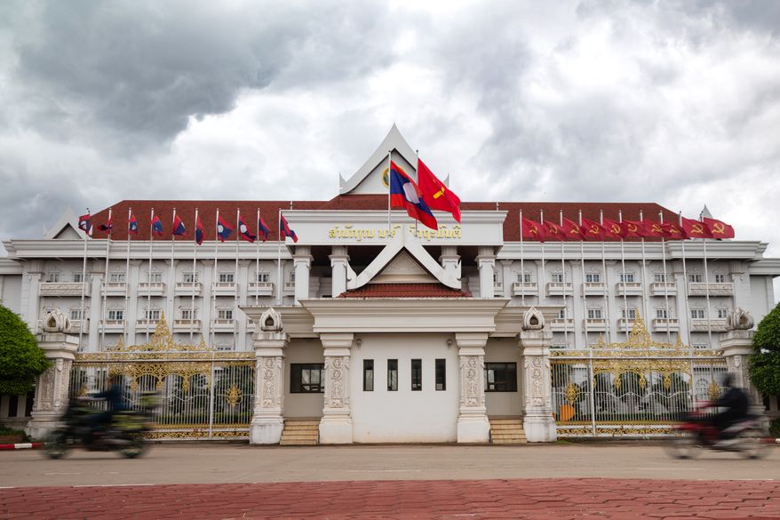 Motorists drive past a government building in Vientiane, Laos, on July 24, 2025. (AP Photo/Anton L. Delgado) ** FILE **
