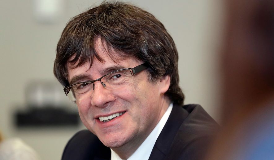 In this April 18, 2018 file photo, former Catalan leader Carles Puigdemont attends a meeting with lawmakers of his party, Junts per Catalunya (Together for Catalonia), in Berlin, Germany. (AP Photo/Michael Sohn, file)