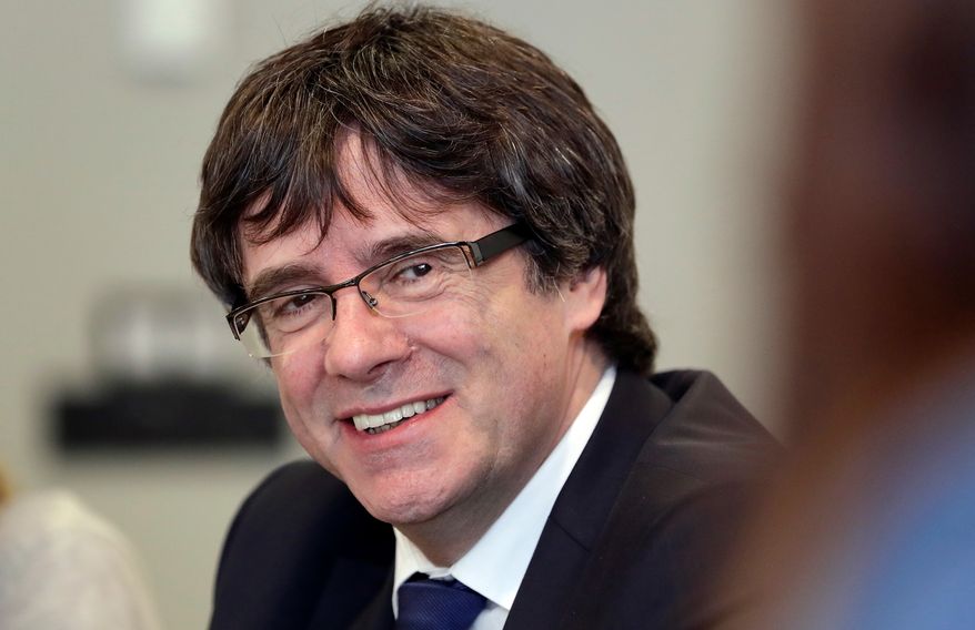In this April 18, 2018 file photo, former Catalan leader Carles Puigdemont attends a meeting with lawmakers of his party, Junts per Catalunya (Together for Catalonia), in Berlin, Germany. (AP Photo/Michael Sohn, file)