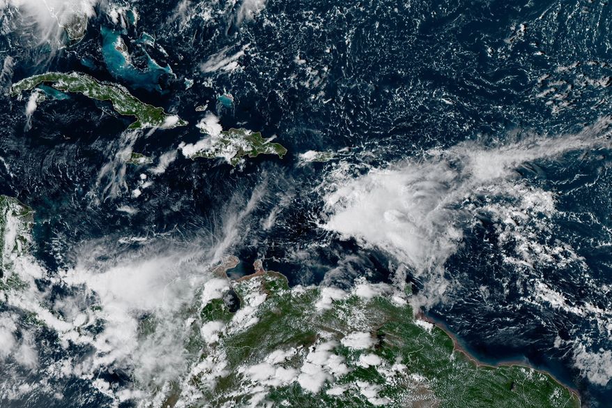 This satellite image provided by NOAA shows clouds over the eastern Caribbean, Tuesday, Oct. 6, 2026. (NOAA via AP)