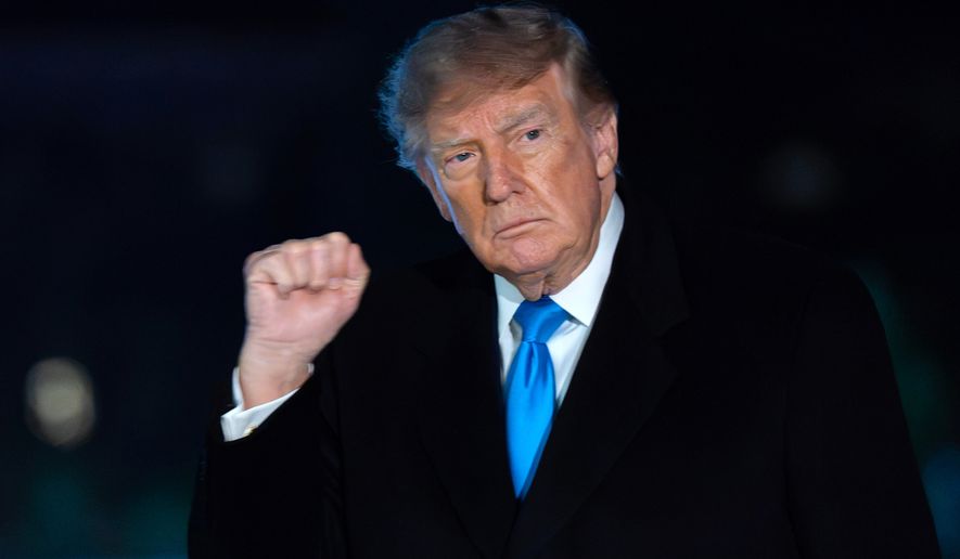 President Donald Trump gestures to reporters as he walks on the South Lawn upon his arrival at the White House, Monday, Oct. 5, 2026, in Washington. (AP Photo/Jose Luis Magana)