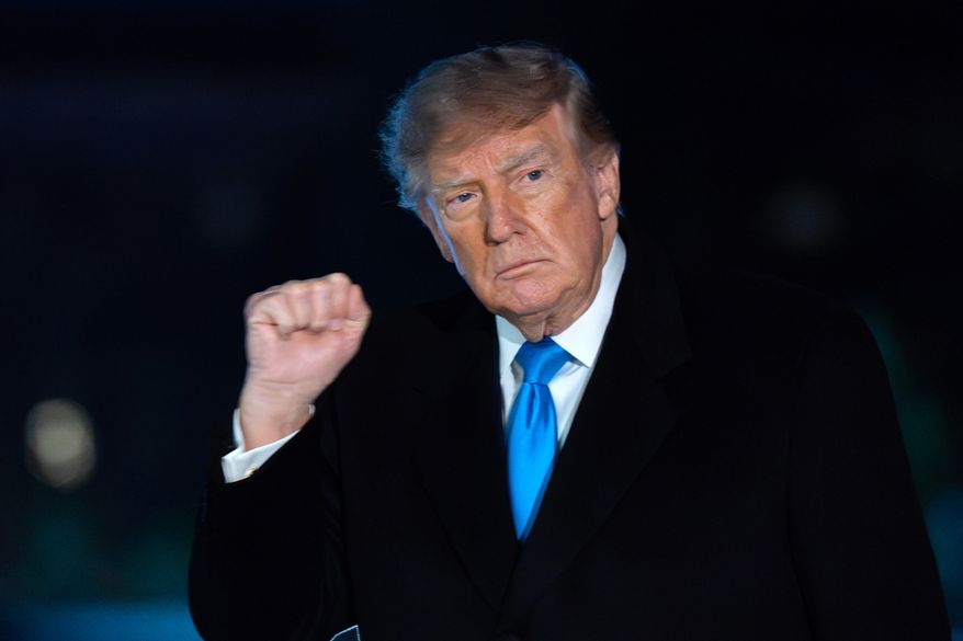 President Donald Trump gestures to reporters as he walks on the South Lawn upon his arrival at the White House, Monday, Oct. 5, 2026, in Washington. (AP Photo/Jose Luis Magana)