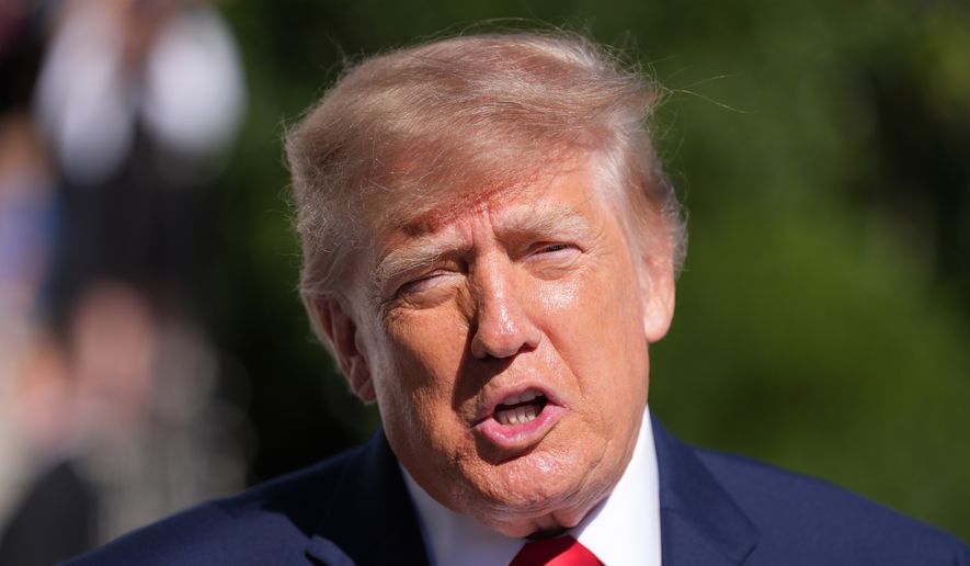 President Donald Trump speaks with reporters before departing on Marine One from the South Lawn of the White House, Tuesday, Oct. 6, 2026, in Washington. (AP Photo/Alex Brandon)
